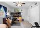 Cozy bedroom featuring a ceiling fan, closet, monitors, desk, and a chair at 617 E Citrus St, Altamonte Springs, FL 32701