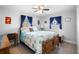Comfortable bedroom features a wooden bed frame, hardwood floors, and bright natural light at 617 E Citrus St, Altamonte Springs, FL 32701