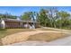 Charming front exterior featuring a well-maintained yard, and solar panels at 617 E Citrus St, Altamonte Springs, FL 32701