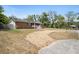 View of home with gravel driveway, showing solar panels on the roof at 617 E Citrus St, Altamonte Springs, FL 32701