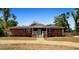 Charming single-story brick home with a welcoming front porch and a well-maintained gravel yard at 617 E Citrus St, Altamonte Springs, FL 32701