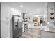 Contemporary kitchen boasts stainless steel appliances, stone countertops, and a seamless open layout at 617 E Citrus St, Altamonte Springs, FL 32701