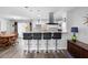Bright kitchen with breakfast bar, modern stainless vent hood, and an open floor plan at 617 E Citrus St, Altamonte Springs, FL 32701