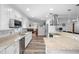 Well-lit kitchen featuring stone countertops, stainless steel appliances, and an open layout at 617 E Citrus St, Altamonte Springs, FL 32701