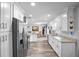 Bright kitchen featuring white cabinetry, stainless steel appliances, and stone countertops at 617 E Citrus St, Altamonte Springs, FL 32701