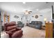 Spacious living room with hardwood floors, neutral paint, ceiling fan and ample seating options at 617 E Citrus St, Altamonte Springs, FL 32701