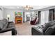 Inviting living room with fireplace, flowing into a kitchen, and a slider to the backyard at 617 E Citrus St, Altamonte Springs, FL 32701