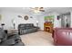 Open-concept living room featuring a fireplace, comfortable seating, and abundant natural light at 617 E Citrus St, Altamonte Springs, FL 32701