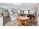 Open-concept living space with eat-in kitchen, hardwood floors, and comfortable seating area at 617 E Citrus St, Altamonte Springs, FL 32701