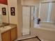 Bathroom features a glass door walk-in shower and a large soaking tub at 643 Orista Dr, Davenport, FL 33897