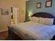 Charming bedroom features a large bed, bedside tables, and carpet flooring at 643 Orista Dr, Davenport, FL 33897