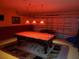 Spacious game room with pool table, foosball, and ample lighting for entertainment at 643 Orista Dr, Davenport, FL 33897