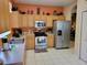 Functional kitchen with stainless steel appliances and ample counter space at 643 Orista Dr, Davenport, FL 33897