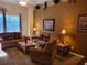 Spacious living room featuring plush seating and a decorative accent wall at 643 Orista Dr, Davenport, FL 33897