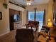 Relaxing living room with a view to the outdoor patio and swimming pool at 643 Orista Dr, Davenport, FL 33897