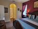 Comfortable bedroom features carpet flooring and a color accent wall at 643 Orista Dr, Davenport, FL 33897