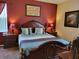 Comfortable bedroom featuring a decorative headboard and bedside tables at 643 Orista Dr, Davenport, FL 33897