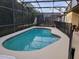 Inviting screened-in pool with -safety fence for secure Gathering fun and relaxation at 643 Orista Dr, Davenport, FL 33897