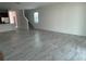 Bright living room with tile flooring, staircase, and a window that lets in natural light at 6712 Golden Eagle Blvd, Howey In The Hills, FL 34737