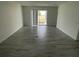 Bright living room with tile flooring and sliding glass doors leading to outdoor space at 6712 Golden Eagle Blvd, Howey In The Hills, FL 34737