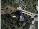 Aerial view of the property showing the house, driveway and lush landscaping at 7237 Edmund Ct, Mount Dora, FL 32757