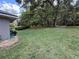 Large backyard features mature trees and a well-maintained lawn at 7237 Edmund Ct, Mount Dora, FL 32757