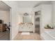 Well-lit bathroom with a double vanity, granite countertops, and a glass shower at 7237 Edmund Ct, Mount Dora, FL 32757