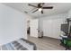 Comfortable bedroom with a ceiling fan, closet, and easy access to other rooms at 7237 Edmund Ct, Mount Dora, FL 32757