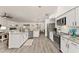Modern kitchen featuring stainless steel appliances, granite countertops, and ample cabinet space at 7237 Edmund Ct, Mount Dora, FL 32757