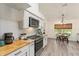 Eat-in kitchen features white subway tile, modern appliances, and breakfast nook at 7237 Edmund Ct, Mount Dora, FL 32757