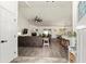Open-concept living room featuring a fireplace and seamless flow into the kitchen at 7237 Edmund Ct, Mount Dora, FL 32757