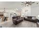 Bright living room with high ceilings, a ceiling fan, and an open floor plan to the kitchen at 7237 Edmund Ct, Mount Dora, FL 32757