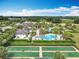 Expansive aerial view showcasing the community's pools, recreational areas, and manicured landscaping at 7748 Four Seasons Blvd, Kissimmee, FL 34747