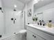 Modern bathroom with glass-enclosed shower, white vanity, and contemporary fixtures at 7748 Four Seasons Blvd, Kissimmee, FL 34747