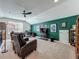 Large bonus room with an accent wall, entertainment area, office space, and comfortable seating at 7748 Four Seasons Blvd, Kissimmee, FL 34747