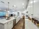 Bright, open kitchen featuring a large island, modern appliances, and seamless flow to the living area at 7748 Four Seasons Blvd, Kissimmee, FL 34747