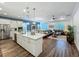 Bright and spacious open floor plan with living, kitchen, and dining areas at 7748 Four Seasons Blvd, Kissimmee, FL 34747