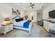 Comfortable main bedroom with ceiling fan, carpet, ensuite bathroom and walk-in closet at 7748 Four Seasons Blvd, Kissimmee, FL 34747