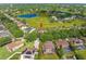 Picturesque aerial view of the home with large lake, surrounding community, and lush green space at 7867 Horse Ferry Rd, Orlando, FL 32835