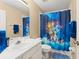 bathroom featuring a custom shower curtain and a vanity, for a fun and functional space at 7867 Horse Ferry Rd, Orlando, FL 32835