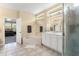 Bathroom featuring a tub, vanity with double sinks, a glass-enclosed shower, and tile flooring at 7867 Horse Ferry Rd, Orlando, FL 32835
