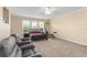 Spacious bedroom featuring a black bed frame with red bedding and exercise equipment at 7867 Horse Ferry Rd, Orlando, FL 32835