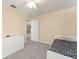 Bright bedroom featuring neutral colors, carpet, closet, and lots of natural light at 7867 Horse Ferry Rd, Orlando, FL 32835