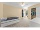 Cozy bedroom with a window, closet, and a view, offering a comfortable and organized space at 7867 Horse Ferry Rd, Orlando, FL 32835
