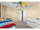 Bright bedroom with a view to another room, featuring a closet and neutral carpet at 7867 Horse Ferry Rd, Orlando, FL 32835