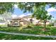 Beautiful two-story home with manicured lawn, solar panels, and lovely curb appeal at 7867 Horse Ferry Rd, Orlando, FL 32835