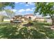 Beautiful two-story home with a well-maintained lawn and mature trees at 7867 Horse Ferry Rd, Orlando, FL 32835