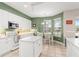 Bright kitchen with white cabinets, granite countertops, and a center island with a dining area at 7867 Horse Ferry Rd, Orlando, FL 32835