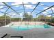 Inviting screened-in pool area featuring lush landscaping and plenty of space for outdoor seating and entertaining at 7867 Horse Ferry Rd, Orlando, FL 32835