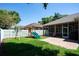 Well-maintained backyard with a play area, screened lanai, and privacy fence, perfect for Gathering fun at 8037 Bangle Ln, Orlando, FL 32836